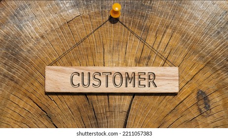 Customer Text . Written On Wooden Hanging Frame. Background Wood Cut Log.