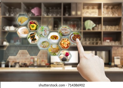 Customer use AR application to order food in restaurant, Hand touching virtual interface for order menu in restaurant, Augmented reality with electronic menu for restaurant. 