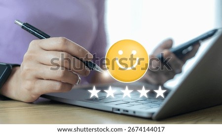 Customer using a laptop and smartphone with smiley face and five-star rating icons. Concept of online feedback, customer satisfaction, review, business service quality, and digital survey.