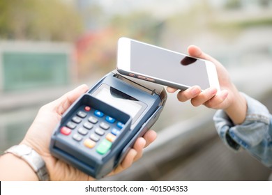 Customer Using Mobile Phone For Pay By The Bill