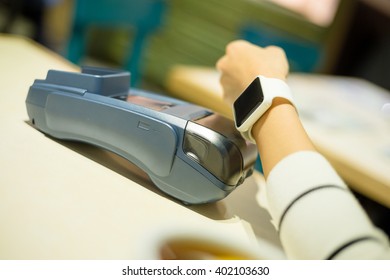 Customer using smart watch to pay