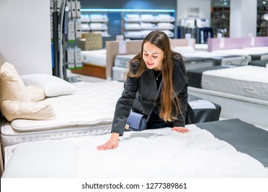 Customer Woman Buying New Furniture - Bed In A Store Supermarket Mall Store