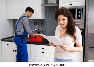 Customer Woman With Expensive Repairs Invoice At Home