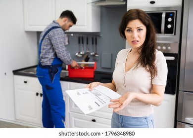 Customer Woman With Expensive Repairs Invoice At Home