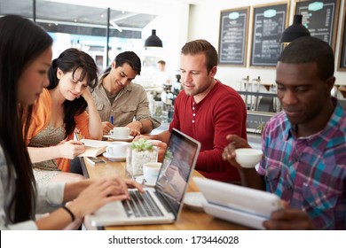 Customers In Busy Coffee Shop