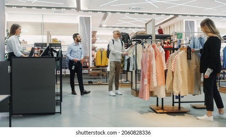 Customers Shopping In Modern Clothing Store, Retail Sales Associate Assists Clients. Diverse People In Fashionable Shop, Choosing Stylish Clothes, Colorful Brand Designs, Quality Sustainable Materials