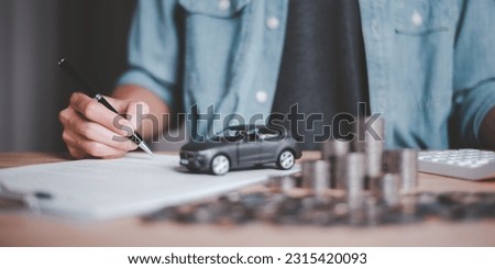 Customers sign insurance documents or car rental forms ,Providing financial services and car insurance ,financial car loans ,car purchase agreement ,Approval of hire-purchase agreements