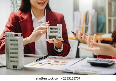 Customers who choose to buy a condominium room and a bank approve a loan for their purchase. Condominium and house loan interest rate from bank concept - Shutterstock ID 2235158737