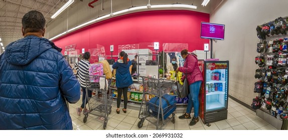 Customers In Winter Coats In A Line With A Full Cart To The Cashier Checkout In A Burlington Store, Holiday Shopping, Super-wide-angle, New York, Bronx, Bay Plaza, United States Of America, 11.05.2021