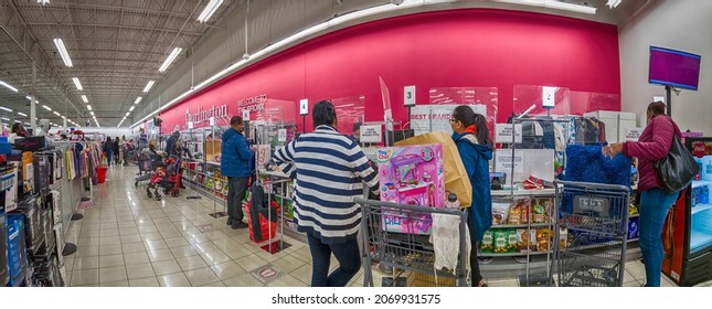 Customers In Winter Coats In A Line With A Full Cart To The Cashier Checkout In A Burlington Store, Holiday Shopping, Super-wide-angle, New York, Bronx, Bay Plaza, United States Of America, 11.05.2021