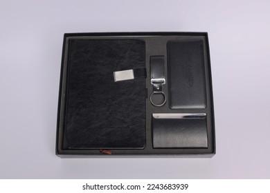 Customized corporate gift box mock up image, Personalized power bank with mobile stylus, hard cover Customized notebook and id card holder,  Customized leather keychain , Black color concept 