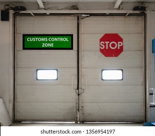 Customs Control Zone Automatic Gates Doors Inside Security Check Area With Vivid Red Stop Sign. Concept Of Closed Border For Import Or Export