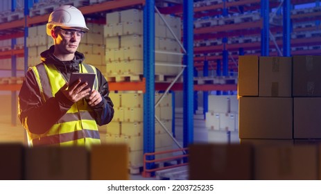 Customs Officer Man. Guy With Boxes In Bonded Warehouse. Customs Check Of Goods At International Border. Customs Officer With Tablet Computer. Man Storekeeper In Reflective Vest. 