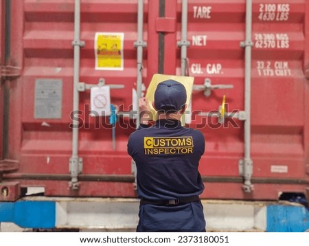 Customs officers carry out investigations on import and export goods in containers. Customs officers at the port seal and inspect the container doors.