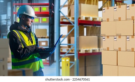 Customs warehouse worker. Man with laptop in storage room. Manager controls operation of warehouse through computer. Man inside bonded warehouse. 