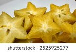 Cut Averrhoa carambola aka carambola star fruit shot with selective focus and blur background