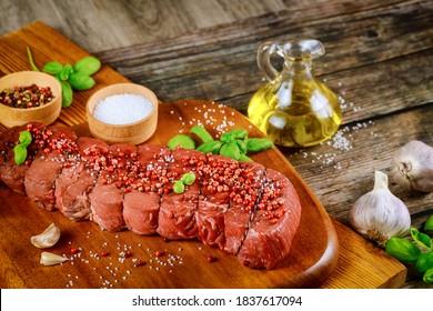 Cut Bottom Round Beef With Spices, Oil And Basil.