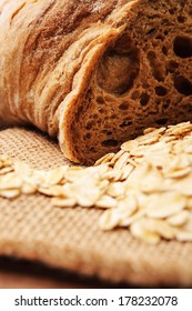 Cut bread and oats on a linen cloth - Shutterstock ID 178232078