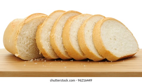 The cut bread on a chopping board. It is isolated on a white background - Powered by Shutterstock