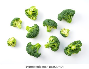 Cut broccoli placed on a white background. View from above