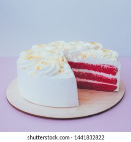 A Cut Of Cake With Whipped Cream On The Table Background.