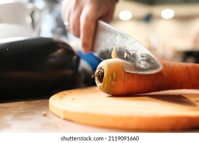 Cut Carrots With A Kitchen Knife