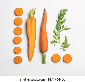 Cut Carrots And Leaves Isolated On White, Top View