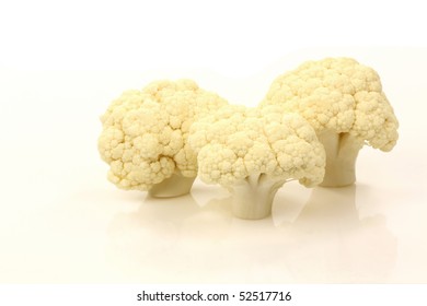 Cut Cauliflower Florets On A White Background