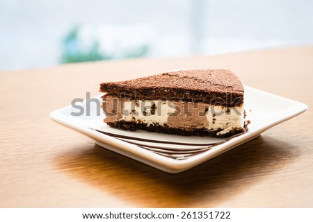 Cut Chocolate cake on the table