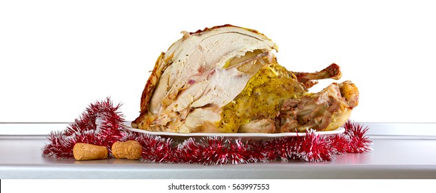 Cut Christmas Turkey On The Kitchen Table, Isolated On White Background