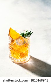 Cut Crystal Glass Whit Orange Liquid (whisky) Rosemary And Orange Slice. Hard Light