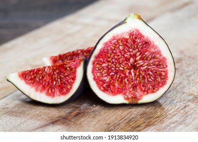 Cut Fruit Of Ripe Figs On A Wooden Cutting Board, Close-up Of Figs For Cooking, Fig Pulp