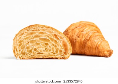 Cut in Half Croissant with Inside Texture and Thin Crisp Layers. Delicious French Pastry. Light background. - Powered by Shutterstock