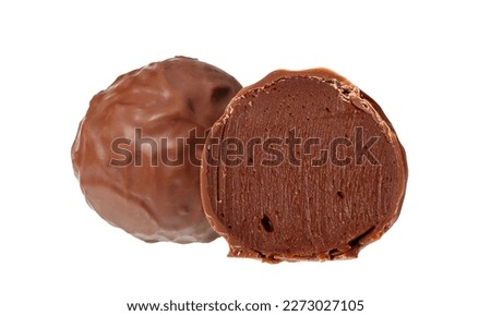 Cut handmade chocolate bonbon candy isolated on white background. Exclusive handcrafted candy. Product concept