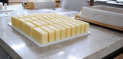 Cut Handmade Soap - Making Handmade Soap Inside The Soap Shop. Cut Handmade Soap On A Table.  
