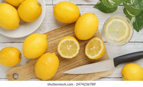 Cut lemon and lemon water on the table. - Powered by Shutterstock