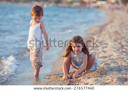 Similar – Two kids digging on the beach