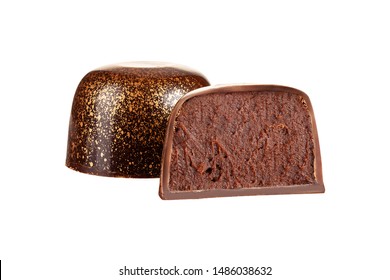 Cut luxury handmade bonbon with chocolate ganache filling isolated on white background. Exclusive handcrafted candies. Product concept for chocolatier 