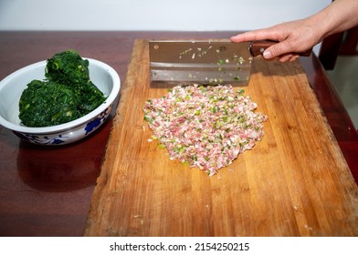 Cut Up The Meat To Make Dumplings