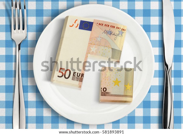Cut money on\
plate, financial share\
concept