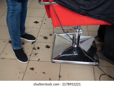 Cut Off Hair On The Floor In The Barber Shop . Master's Feet