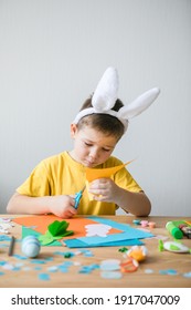 Cut Out Bunny Blanks From Multi-colored Paper. Childrens Handmade Easter Craft, DIY