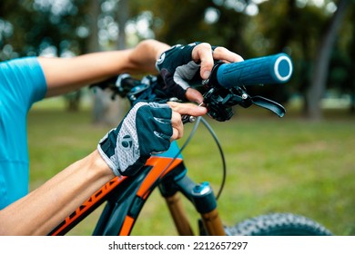 Cut Out Image Of Unrecognizable Female Replacing Cycle Handle Grip. Sporty Mature Woman Cyclist Fixing Her Bike Outdoor