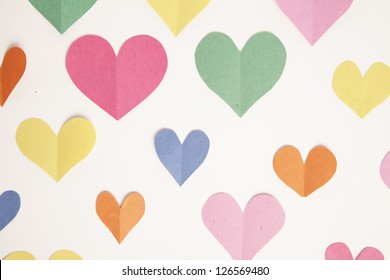 Cut Out Paper Hearts From Construction Paper Form A Background.