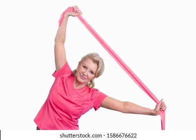 Cut Out Of Senior Woman Using Exercise Bands In Gym