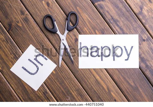 cut-paper-word-unhappy-stock-photo-440751040-shutterstock