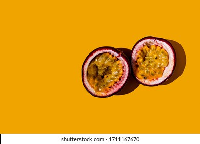 Cut Passion Fruit On A Yellow Background.