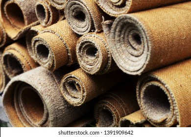 Cut Up And Rolled Old Carpets.