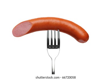 Cut Sausage On Fork Isolated On A White Background