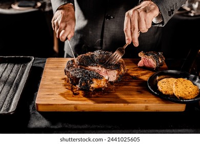 Cut and Served Table Side Tomahawk Steak inside intimate steakhouse restaurant